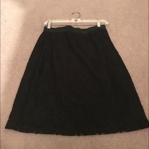 A black mini lace skirt